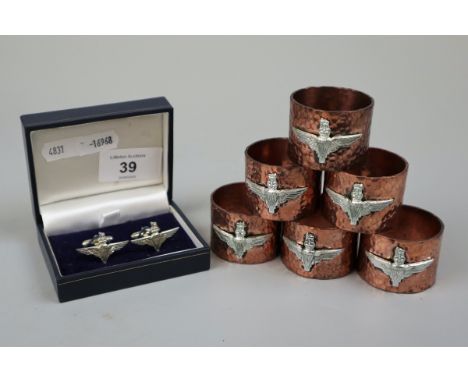 Hammered copper napkin rings with Para Reg badge together with a set of Para cufflinks