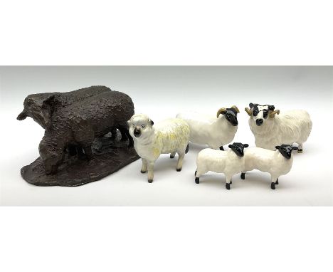 Two Beswick rams, two lambs, and a further sheep, together with a bronzed model of two sheep. Click here to view further imag