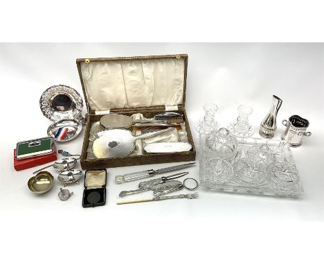 A cased silver mounted dressing table set, comprising hand held mirror, hair brush and clothes brush, with engine turned deco