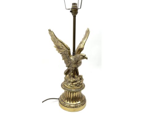 A brass table lamp modelled in the form of an eagle upon a circular base, overall H73cm.Click here to view further images, co