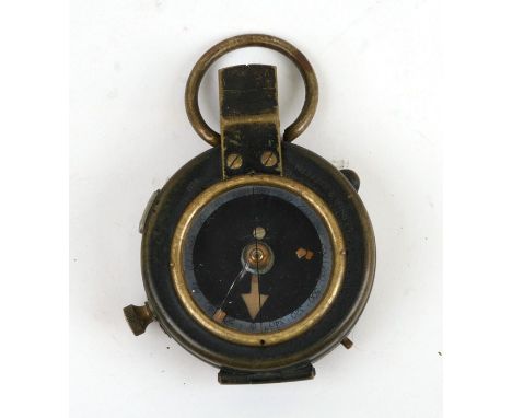 A WWI brass field compass, the reverse impressed FL Broad Arrow No. 77796 1917.