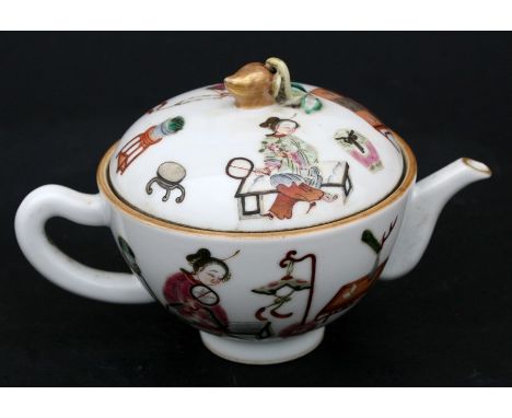 A Chinese famille rose teapot decorated with figures with gilded peach finial, a red seal mark to the underside, 10cms (4ins)