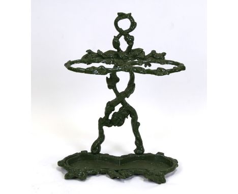 A Victorian painted cast iron two-division stick stand, 48cms (19ins) wide.