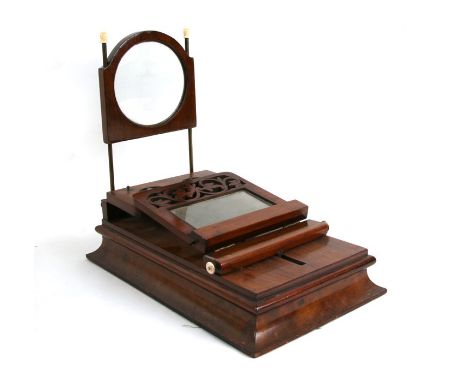 A Victorian figured walnut stereo graphoscope with a pair of stereo lenses, magnifying lens on brass rods and ground glass sc