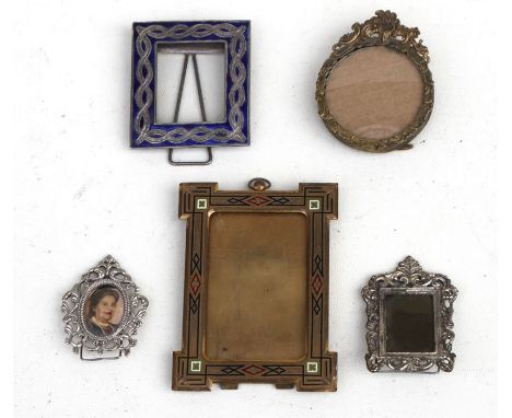 A group of portrait miniature picture frames.