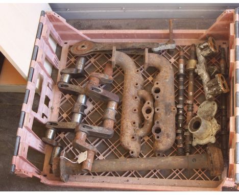 Assorted Austin 7 spares including crankshafts, propshafts, inlet manifolds, camshafts, bearings, head light bulbs and other 