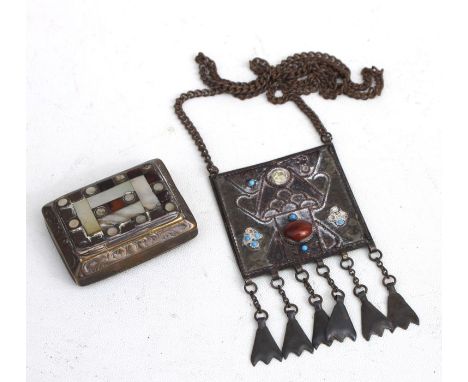A mother of pearl and tortoiseshell inlaid brass snuff box; together with an Arts &amp; Crafts style pendant (2).