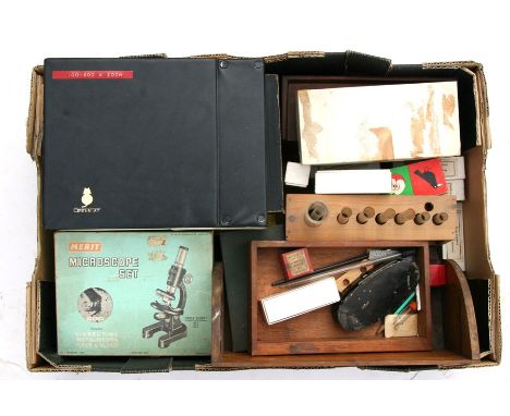 A Merrit microscope set, microscope slides and other scientific instruments.