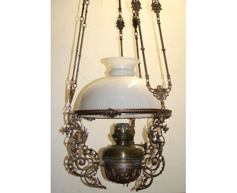 A Malaccan ceramic hanging fuel ceiling lamp with white ceramic shade and font with chains for height adjustment, converted f