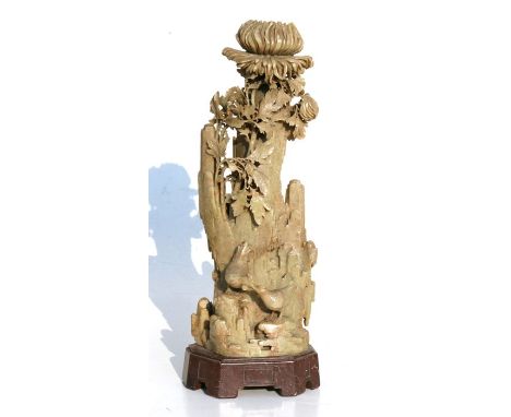 A Chinese soapstone candlestick in the form of a chrysanthemum with chickens beneath, 31cms (12.25ins) high.Condition ReportM