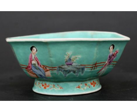 A Chinese famille rose footed bowl of octagonal form decorated with figures on a green ground, red seal mark to the underside