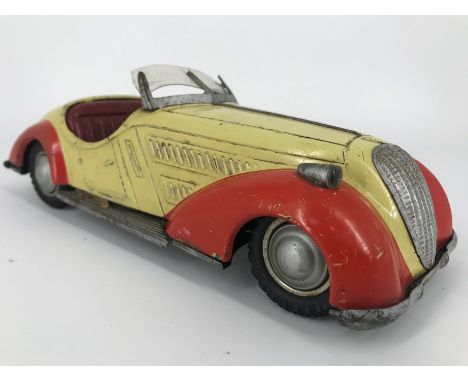 A 1950 Distler BMW Wanderer clockwork tin plate car, manufactured in the US zone of West Germany, having a three speed and re