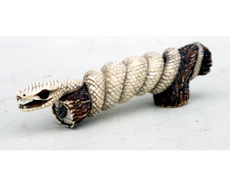 A finely carved ivory faux antler walking stick handle in the form of a snake entwined around a branch, 12cms (4.75ins) long.