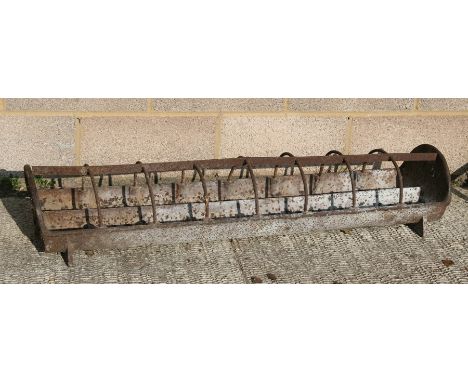 A cast iron feeder / planter, 125cms (49ins) wide.