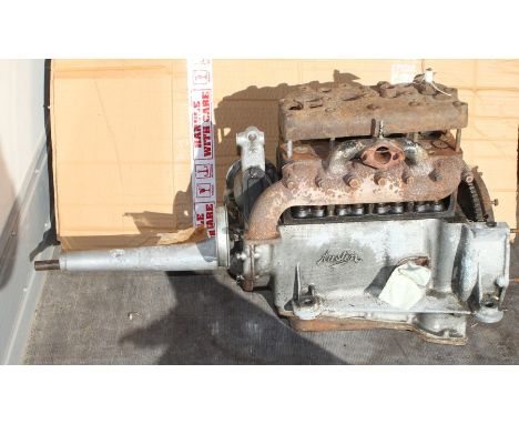 An Austin 7 engine with exhaust manifold, engine number M219796, internal condition unknown.