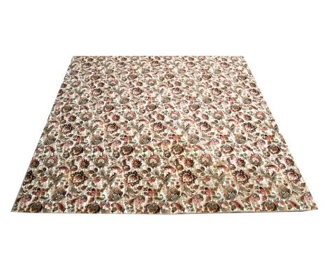 A large persian style carpet with foliate scrolls on a beige ground