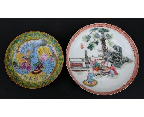 A Chinese Republic shallow dish decorated with children under a tree, blue seal mark to the underside, 18cms (7ins) diameter;