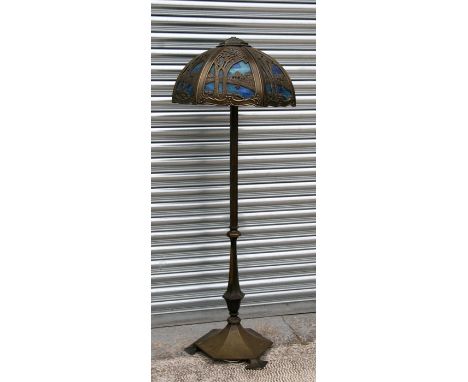 An Arts &amp; Crafts telescopic brass standard lamp with later Tiffany style shade.