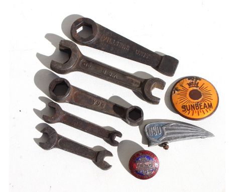 Three original BSA motorcycle spanners, a Villiers Hammertight spanner, an NSU front mudguard insignia, and a Sunbeam enamel 