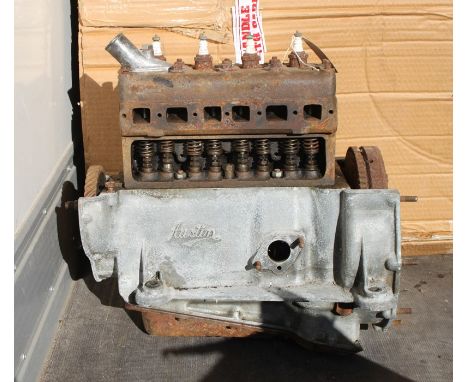 An Austin 7 engine, engine number M201264, internal condition unknown.