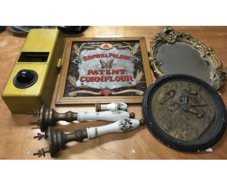 A collection of odds including a old vending machine and  ceramic beer pumps