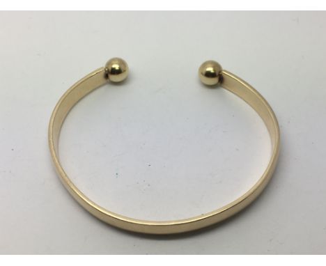 A 9ct gold bangle, approx 20g.