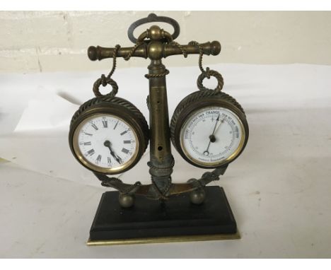 A  brass Desk clock with barometer of naval influence