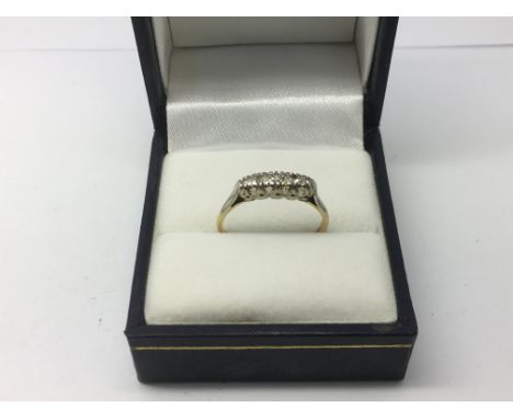 An 18ct gold five stone diamond ring, approx 2g and approx size M.