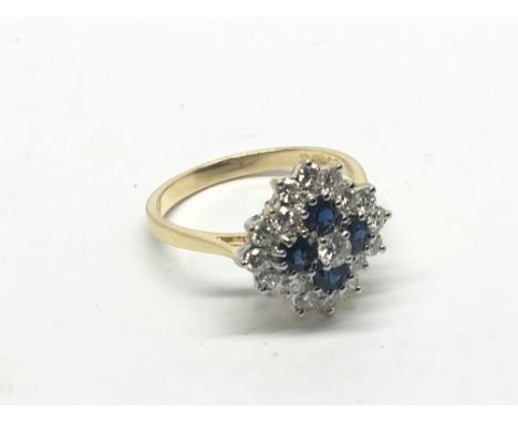 An 18carat yellow gold ring set with a pattern of sapphire and diamonds ring size N-O.