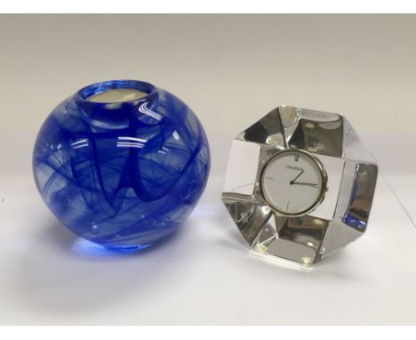 A Kosta Boda blue art glass candle holder by Swedish designer Anna Ehrner together with an Orrefors art glass clock (2).