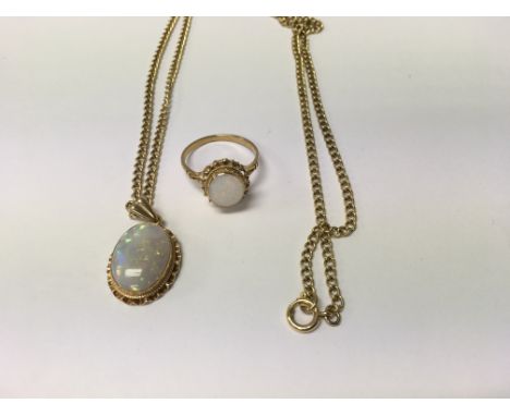 A opal pendant with attached 9 ct gold chain and a matching ring