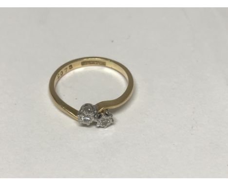 A 18 ct gold ring inset with 2 stone diamond crossover 2.5 grams