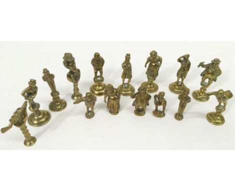 A collection of  fiveteen figural brass pipe tampers,  largely Dicken's characters