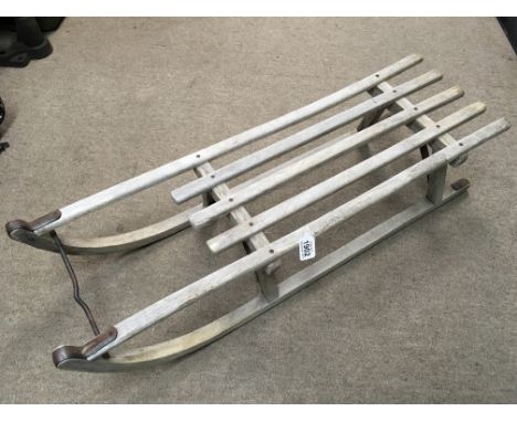 A child’s vintage wooden sledge