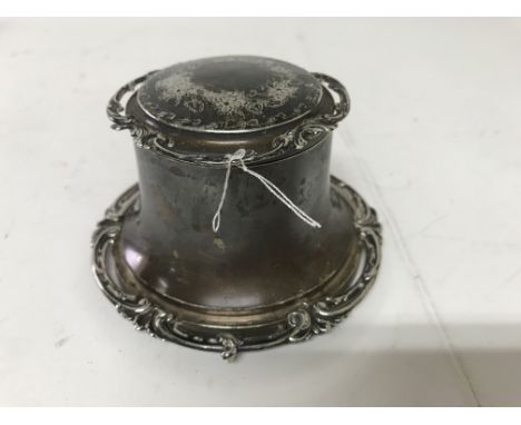 A silver capstan inkwell, with glass inset