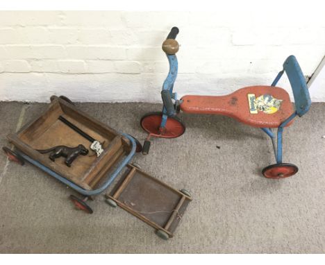 A vintage Triang  child's tricycle, two wooden trucks, gun and novelty pair of nutcrackers