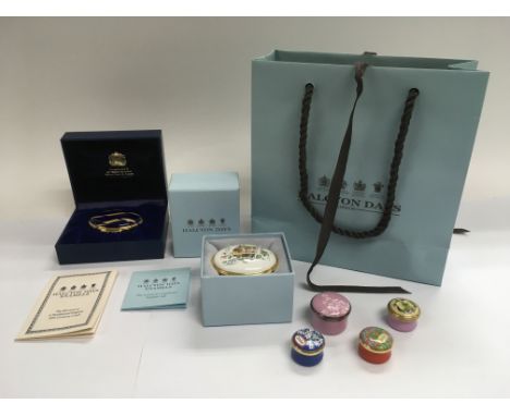 Six Halcyon Days enamel boxes, some in retail boxes, presented in a retail bag.