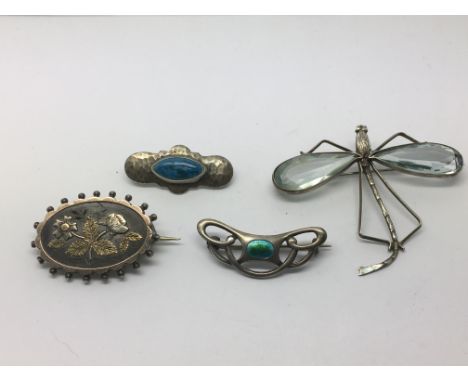 Four brooches comprising a silver and enamel example and three others.