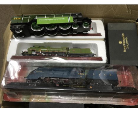 A box of model trains, boxed Royal Hampshire plane and train miniatures.