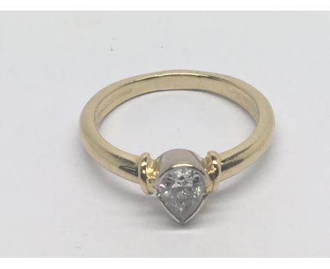 An 18carat yellow gold ring set with a pear shaped diamond 0.45 carat approx. ring size M.