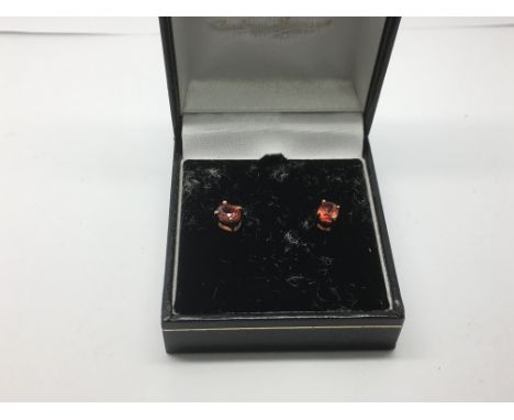 A pair of 9ct gold and ruby ear studs, approx 1.1g.