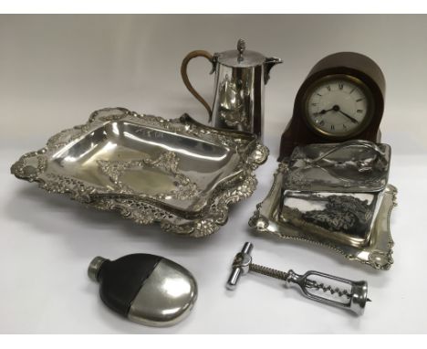 Three items of silver plate, an inlaid mantle clock, hip flask and a bottle opener.