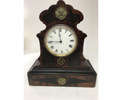 A 19 th century French mantel clock the enamel dial with Roman numerals in a mahogany case