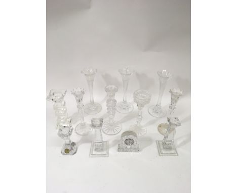 A group of contemporary glass candlesticks and an Edinburgh crystal clock