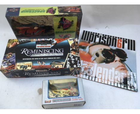 A box of various items including a reproduction Land of the giants, polar lights model kit sealed,a Prisoner 2009 calendar, a