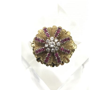 A vintage 18ct gold cocktail cluster rings set with central diamond flanked by rubies.Approx N/0, 8.9g
