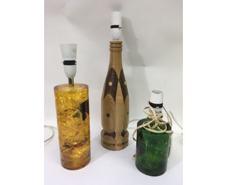 Two vintage shatterline lamp bases and a wooden example
