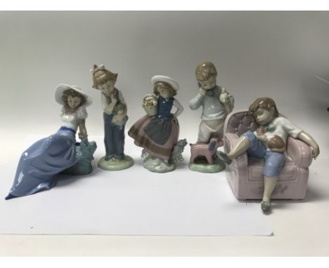Two Lladro figures and three NAO figures