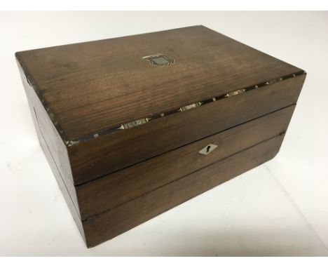 A Victorian writing box with fold over slope and a glass inkwell and key