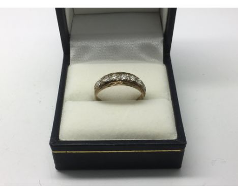 A 9ct gold ring set with seven CZ stones, approx 2g and approx size N.